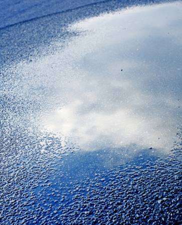 vatten, asfalt, sky, reflexion, väg Bellemedia - Dreamstime