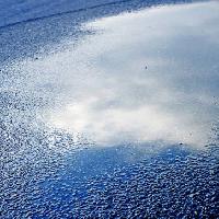 vatten, asfalt, sky, reflexion, väg Bellemedia - Dreamstime